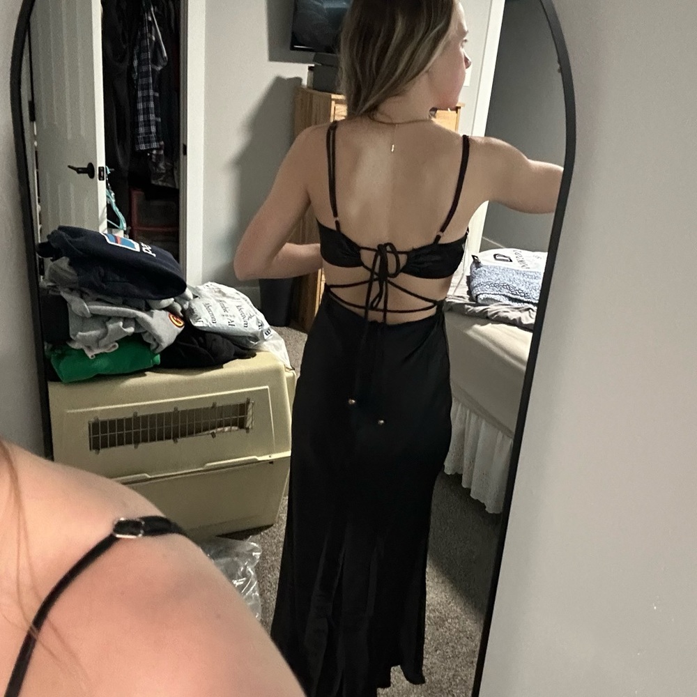NWT Bought for a wedding. It was taken in to fit a size 0.